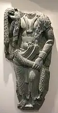 Porteur d'offrandes. Vallée du Swat. Butkara. Ier – IIe&nbsp;siècle. Schiste. Museo d'Arte Orientale, Turin
