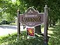 Panneau à l'entrée du village de l'Avenir