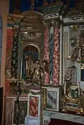 Panneau gauche avec un évêque et un ange adorateur