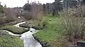 Parc de la Bressonnière vu depuis la passerelle sur le Ruisseau de Charbonnières