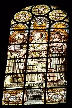 Vitrail de saint Vincent de Paul avec François de Sales et Jean-Baptiste de La Salle.
