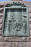 Le bas relief nord illustre la harangue de Paul Kruger aux Boers à Paardekraal en 1880, 2 jours avant le déclenchement de la première guerre des Boers.