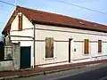 Pavillon double pour ouvriers de 1906, dans la 1re&nbsp;rue Charles Gabel. Il garde à peu près son aspect d'origine, hormis les volets qui ont été échangés. Il en existe trois exemplaires, plus un muni ultérieurement d'un étage.