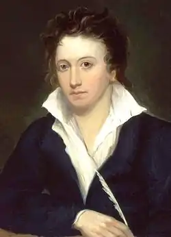 Portrait d'un jeune homme vêtu d'une chemise blanche et d'une veste noire et tenant une plume dans sa main droite