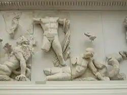 homme nu terrassant un géant à terre