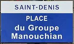 Photographie du panneau de la place du groupe Manouchian de Saint-Denis.