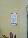 Plaque à l'entrée du clocher de l'église Notre-Dame-de-l'Assomption de Petit-Bourg commémorant la restauration du 30 mars 2021.
