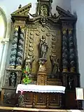 L'église paroissiale, le retable du Rosaire (1660, en bois).