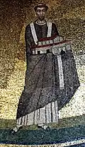 Le pape Honorius Ier (mort en 638), mosaïque dans l'église Sant'Agnese fuori le Mura à Rome, portant une maquette de l'église qu'il construit.