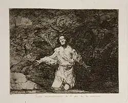 Un personnage seul sur ses genoux en haillons regarde désespérément vers le ciel.