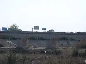Pont de l'ancienne route de Madrid sur le ravin du Poio.