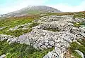 Hillfort Tre'r Ceiri sur les pentes du Yr Eifl. Quelques emplacements de maisons de l'âge du fer.