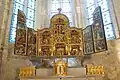 Retable encadré des chasses reliquaires et le tabernacle de Jean de Watteville