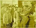 Au centre, dans Rimrock Jones&nbsp;(en) (1918), avec Wallace Reid le tenant