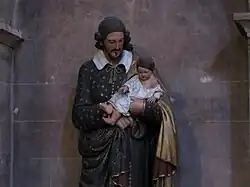 Statue de saint Vincent-de-Paul portant l'enfant Jésus (1829).