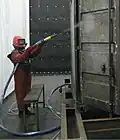 sablage de pièces métalliques pour décapage par abrasion