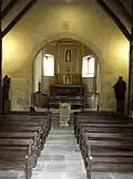 L'arc triomphal, repris au XIVe&nbsp;siècle, qui sépare la nef du chœur.