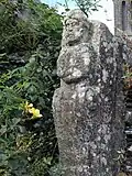 Atlante près du calvaire du bourg près de l'église Saint-Séverin de Saint-Ségal.
