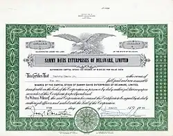 Action fondatrice no 1 de Sammy Davis Enterprises of Delaware, Ltd. de 6 parts de 100 $ chacune, émise le 25 mars 1965, enregistrée au nom de Sammy Davis Jr. et portant sa signature manuscrite de président. Le capital-actions de sa société de production était de 10 000 $.