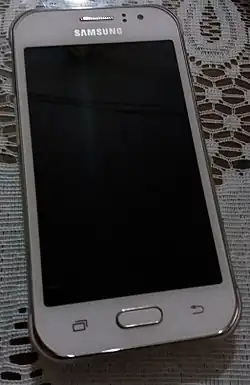 Un téléphone éteint de couleur blanc
