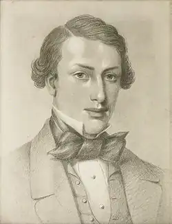 Portratit en noir et blanc d'un jeune homme en costume