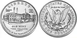 Les deux faces d'une pièce de monnaie. Sur l'avers un bâtiment industriel, sur le revers un aigle héraldique.