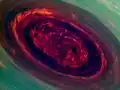 Image en fausse couleurs du vortex au centre de l'hexagone, par la sonde Cassini.