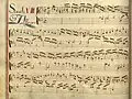 partition manuscrite rehaussée de couleurs, titre rouge et bleu