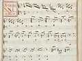 partition manuscrite rehaussée de couleurs passées vert et rouge en bordures et cadre de titre, titre en rouge