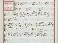 partition manuscrite aux couleurs passées rouge et vert en bordures, titre en rouge