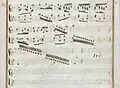 partition manuscrite aux couleurs passées rouge et vert en bordures