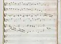 partition manuscrite rehaussée de couleurs passées rouge et vert en bordures