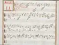 partition manuscrite rehaussée de couleurs passées vert et rouge en bordures et cadre de titre, titre en rouge