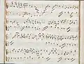 partition manuscrite rehaussée de couleurs passées vert et rouge en bordures