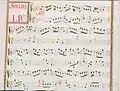 partition manuscrite rehaussée de couleurs passées rouge et bleu en bordures et cadre de titre, titre en rouge
