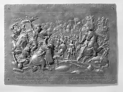 Scène de bataille antique en relief métallique