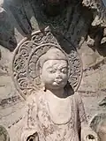 Figure bouddhique arborant un nimbe en mandala (VIe siècle).