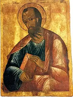 Dans un style médiéval, sur fond or, est représenté un saint - repéré par son auréole - montre un livre. Son visage occupe le quart supérieur. Il observe le spectateur, est incliné à gauche, barbu aux cheveux noirs. Les trois quarts inférieurs sont occupés par les vêtements en rouge et bleu et par les mains du saint qui enseigne le livre.