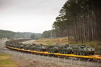 288 Strykers de la 1re Stryker Brigade Combat Team, 25e&nbsp;division d'infanterie américaine arrivent à Anniston Army Depot&nbsp;(en), 10 mars 2011.