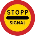 Arrêtez-vous au panneau si le signal est rouge