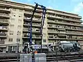 Image représentant l’utilisation d’une pompe à béton avec la pose des rails.