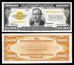 Billet de 100,000 $US où on peut voir en arrière-plan le symbole « dollar » avec deux barres au lieu d’une.