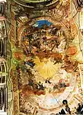 Vue de la fresque du plafond avec le monogramme IHS des jésuites