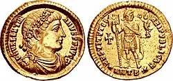Médaille présentant sur une face un profil d'homme pourvu d'un diadème et sur l'autre face un homme debout tenant un étendard et une statuette de Victoire