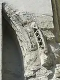 Croisillon sud, mur oriental, archivolte du portail bouché.
