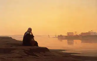 Un personnage regarde un lever de soleil sur le Nil