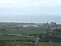 En regardant en direction de ‘Mayor Island’ en descendant vers ‘Domain Rd’ à partir de « Papamoa Hills ».