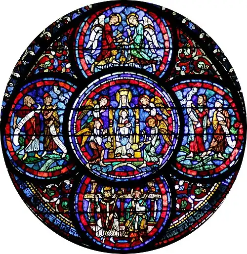 Vitrail des miracles de la Vierge : en bas, Fulbert tient une maquette de sa cathédrale.