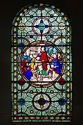 Vitrail représentant L’entrée triomphale de Jésus à Jérusalem, les Rameaux, dans l’église Saint-Sulpice à Breteuil-sur-Iton.