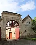 Portail d'entrée de ferme daté de 1838.